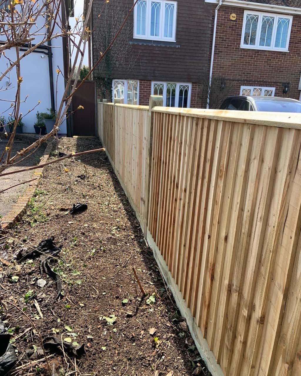 This is a photo of feather edge fencing installed in a residential property by Fast Fix Fencing Caterham