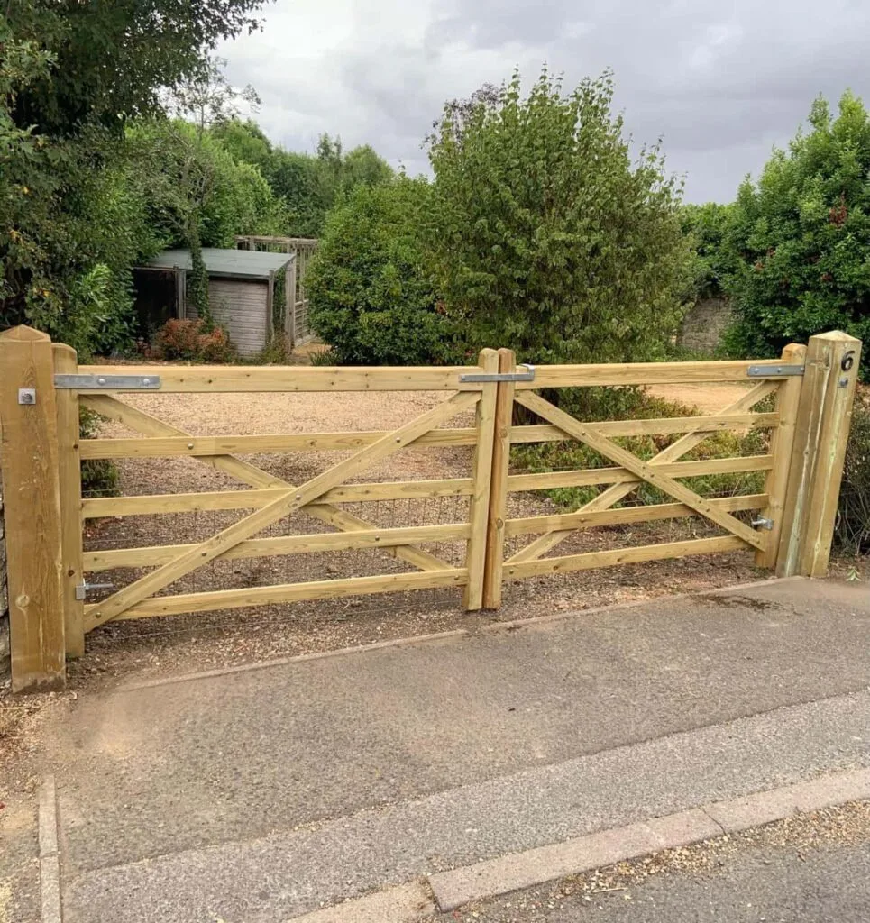 This is a photo of a wooden driveway gate installed by Fast Fix Fencing Caterham